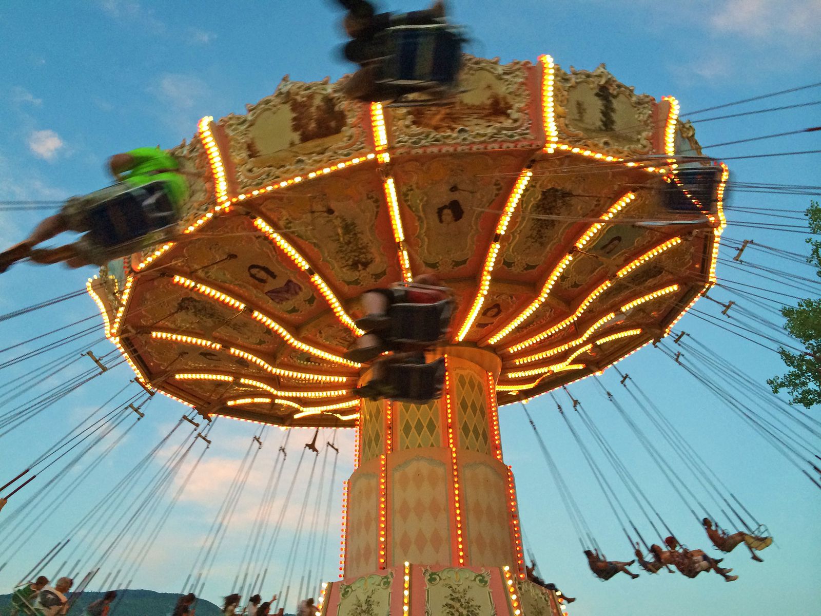 Turn of the Century mid-spin against a blue sky